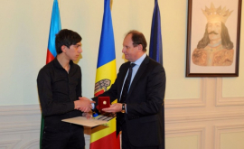 Ambasadorul moldovean a înmînat Ordinul Credința Patriei