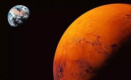 Vapori de apă detectaţi în atmosfera planetei Marte