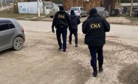Detalii despre perchezițiile CNA de la Ghidighici Patru persoane reținute