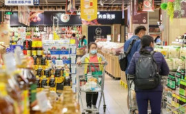 Magazinele alimentare și supermarketurile din Shanghai funcționează din nou