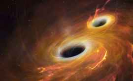 Două găuri negre supermasive care se orbitează una pe alta observate în premieră