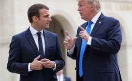 Macron compară discuţiile avute cu Trump cu cîrnaţii