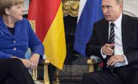 Vladimir Putin se va întîlni astăzi cu Angela Merkel